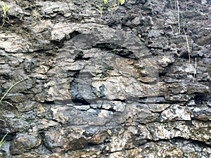 Real Grunge Rock Stone Texture. A real natural stone texture in pale blue, grey and brown ideal as a background, layer.