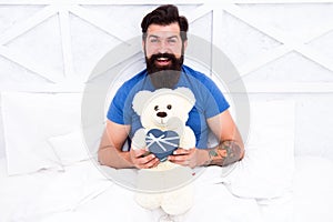 Real happiness. Love and happiness. bearded man teddy bear in bed. Gift box for holidays. nice present for you