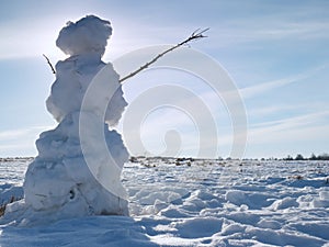 Real icy snowman in winter landscape