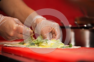 Real kitchen of fast food restaurant and the chef who cooking a doner kebab