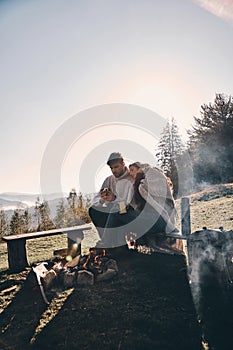 Real love. Beautiful young couple having morning coffee while si