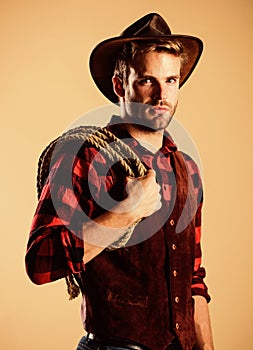 Real man. vintage style man. Wild west retro cowboy. Cowboy with lasso rope. Western. wild west rodeo. Man in hat. man