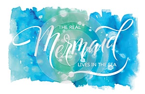 The real mermaid live in the sea, hand written vector lettering on watercolor spot background