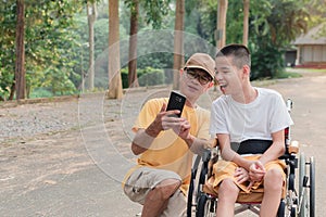 Real People of disabled and parent are using smart phone