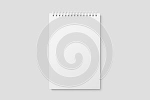 Real photo, blank spiral bound notepad mockup template, isolated on light grey background.