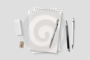 Real photo, blank spiral bound notepad mockup template, isolated on light grey background.