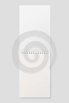 Real photo, blank spiral bound notepad mockup template, isolated on light grey background.