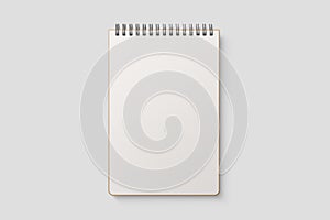 Real photo, blank spiral bound notepad mockup template with Kraft Paper cover, isolated on light grey background.