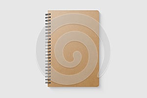 Real photo, blank spiral bound notepad mockup template with Kraft Paper cover, isolated on light grey background.