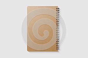 Real photo, blank spiral bound notepad mockup template with Kraft Paper cover, isolated on light grey background.