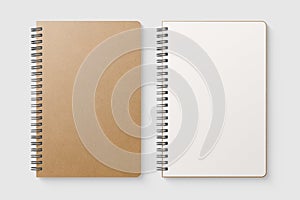 Real photo, blank spiral bound notepad mockup template with Kraft Paper cover, isolated on light grey background.