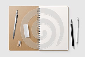 Real photo, blank spiral bound notepad mockup template with Kraft Paper cover, isolated on light grey background.