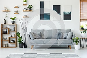 Real photo of an elegant living room interior with a comfy couch photo