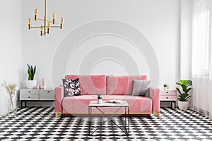 Real photo of a modern living room interior with a checkered flo