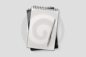 Real photo, spiral bound notepad mockup template with black paper cover, isolated on light grey background.