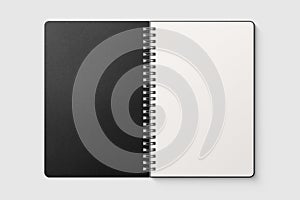 Real photo, spiral bound notepad mockup template with black paper cover, isolated on light grey background.