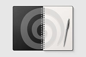 Real photo, spiral bound notepad mockup template with black paper cover, isolated on light grey background.