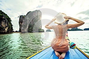 Real photo of traveler woman on the long tail boat looking at the James Bond island Phuket, Thailand, Asia. Tourism destination