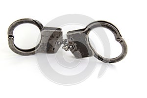 Real police handcuffs isolated on white background