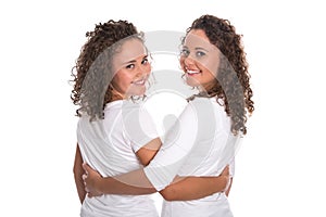 Real similar twins with natural stop curls isolated over white b