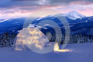 Real snow igloo house in the winter mountains