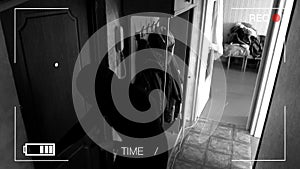 Real surveillance cameras caught and recorded the burglar breaking into the house,came across a dog and runs away