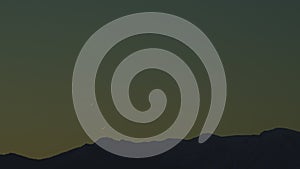 Dramatic Sunset Rays Behind Silhouette Of Mountain. Gradient Vivid Nature Background.