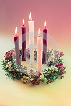 Real traditional christian religious advent wreath with 5 candles, 5 candles burning