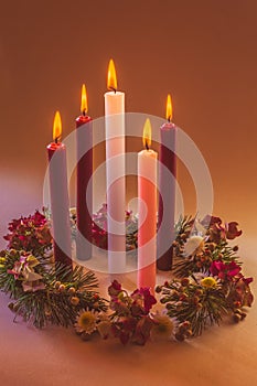 real traditional christian religious advent wreath with 5 candles, 5 candles burning