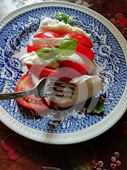 Real tricolore Caprese salad in Italy with real buffala mozzarella