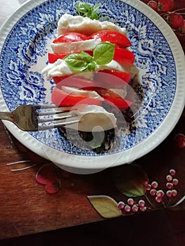 Real tricolore Caprese salad in Italy with real buffula mozzarella