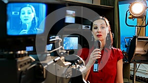 Real TV news reporter in front of the video camera