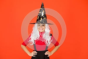 Real witch in disguise. Little child in witch costume. Halloween party. Small girl in black witch hat. Autumn holiday