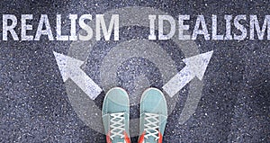 Realism and idealism as different choices in life - pictured as words Realism, idealism on a road to symbolize making decision and photo