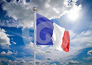 Realistic flag. 3D illustration. Colored waving flag of France on sunny blue sky background