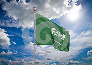 Realistic flag. 3D illustration. Colored waving flag of Saudi Arabia on sunny blue sky background