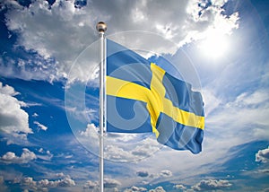 Realistic flag. 3D illustration. Colored waving flag of Sweden on sunny blue sky background