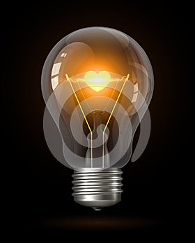 Realistic glowing light bulb with transparency isolated on black. Inside the lamp is incandescent filament with glowing heart.
