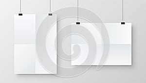 Realistic hanging blank paper sheet with shadow in A4 format and black paper clip, binder on gray background. Design