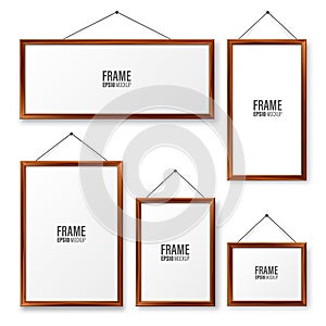 Realistic hanging on a wall blank wooden picture frames set. Modern poster mockup. Empty photo frame with texture of