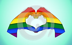 Realistic man hands forming a heart painted as the rainbow flag symbolizing gay love and Gay Pride Movement.Hands showing heart