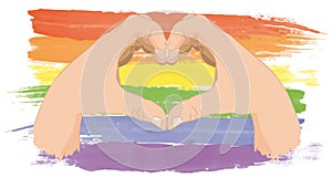 Realistic man hands forming a heart painted on the rainbow flag , symbolizing gay love and gay union pride parade. Hands showing