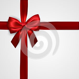 Realistic red bow with crosswise red ribbons isolated on white. Element for decoration gifts, greetings, holidays. Vector