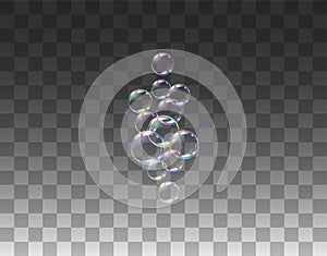 Realistic soap bubbles on transparent background.