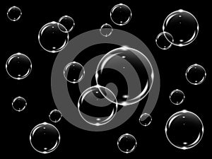 Realistic white transparent soap bubbles on a black background