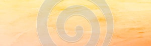 Realistic yellow-orange watercolor panoramic texture on a white background