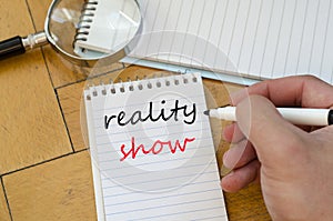 Reality show text concept on notebook