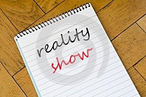 Reality show text concept on notebook