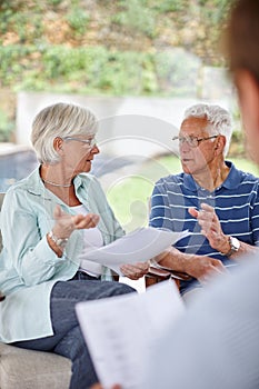 Realize your financial aspirations. Over-the-shoulder shot of a financial advisor meeting with a senior couple at their