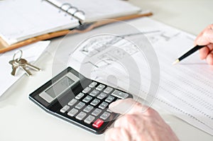 Realtor analyzing financial planning of a house